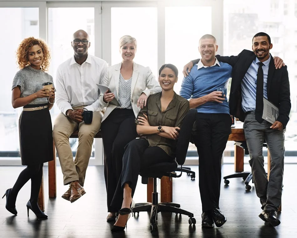 A group of smiling, happy co-workers